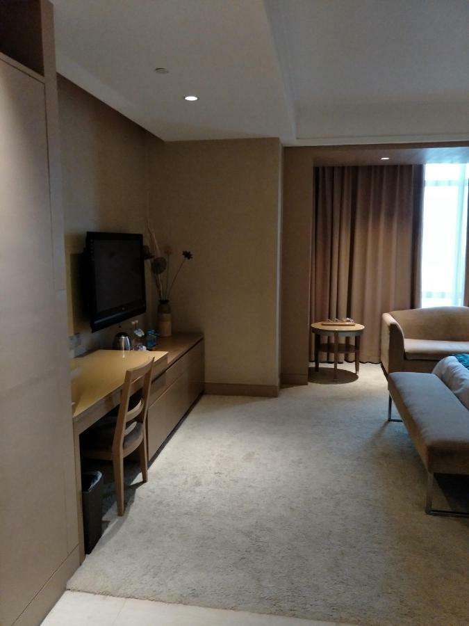 Four Seasons Rayli Hotel Нинбо Экстерьер фото