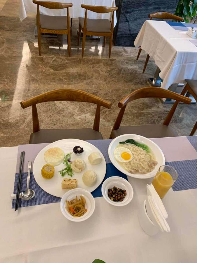 Four Seasons Rayli Hotel Нинбо Экстерьер фото